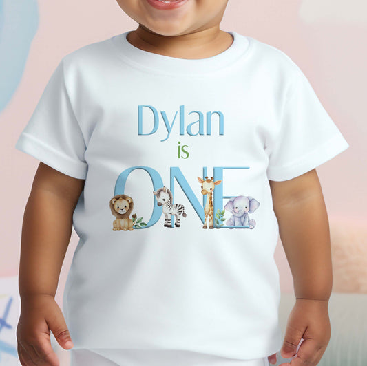 Personalised safari baby blue first birthday bib with jungle animal artwork and the baby's name.