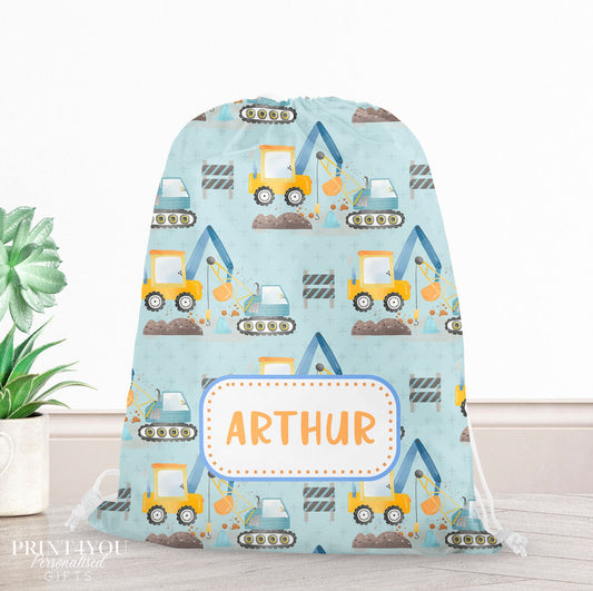 Personalised construction site print drawstring PE bag with a child's name printed on the front, builders and diggers design