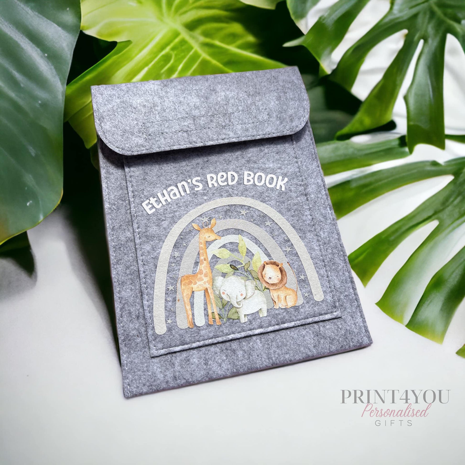 Grey felt red book folder personalised with 'Ethan's Red Book' text and a jungle safari rainbow design featuring a giraffe, elephant and lion