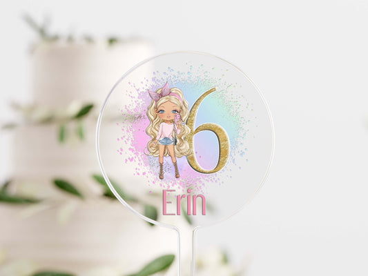 Clear acrylic cake topper on a stick, UV printed with a fashion doll design and personalised with a name for a birthday cake