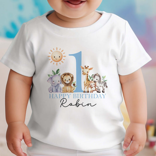 Personalised safari first birthday bib in soft white cotton, printed with lions, elephants and giraffes in blue text.