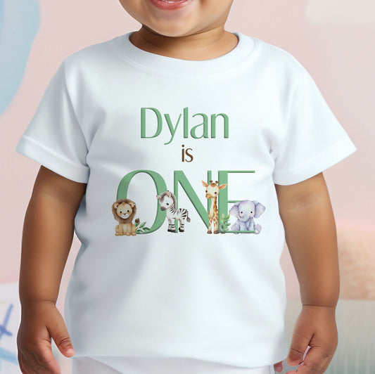 Sage green safari-print bib personalised with baby's name for a first birthday outfit.