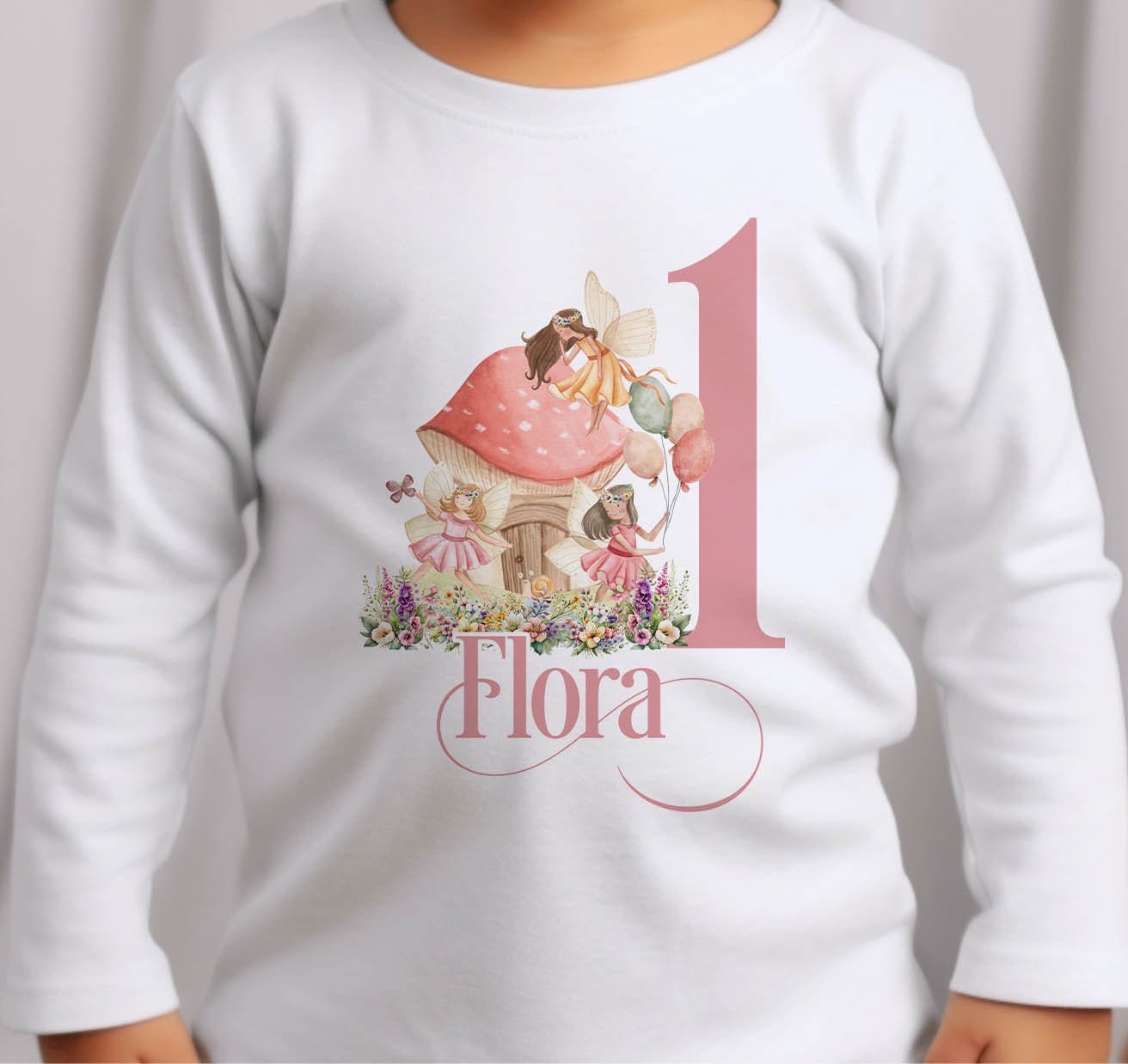 The pink fairytale fairies first birthday outfit laid out as part of the personalised collection.