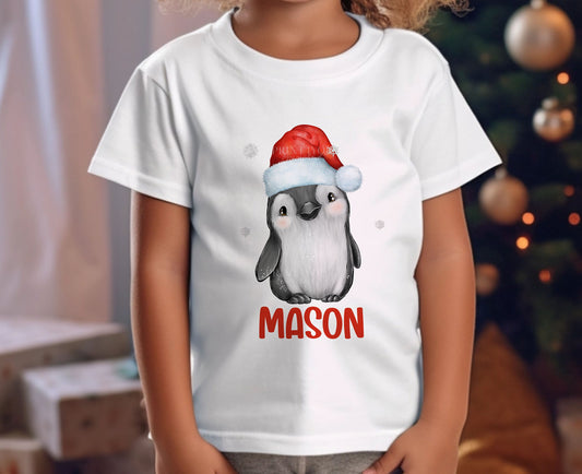 Personalised Children's Christmas T – Shirt – Unisex Design, Father Christmas Penguin and Name - 6-12 months  T-shirt