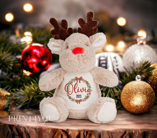 Personalised plush reindeer toy with a Christmas wreath, printed with a name, baby's first Christmas keepsake