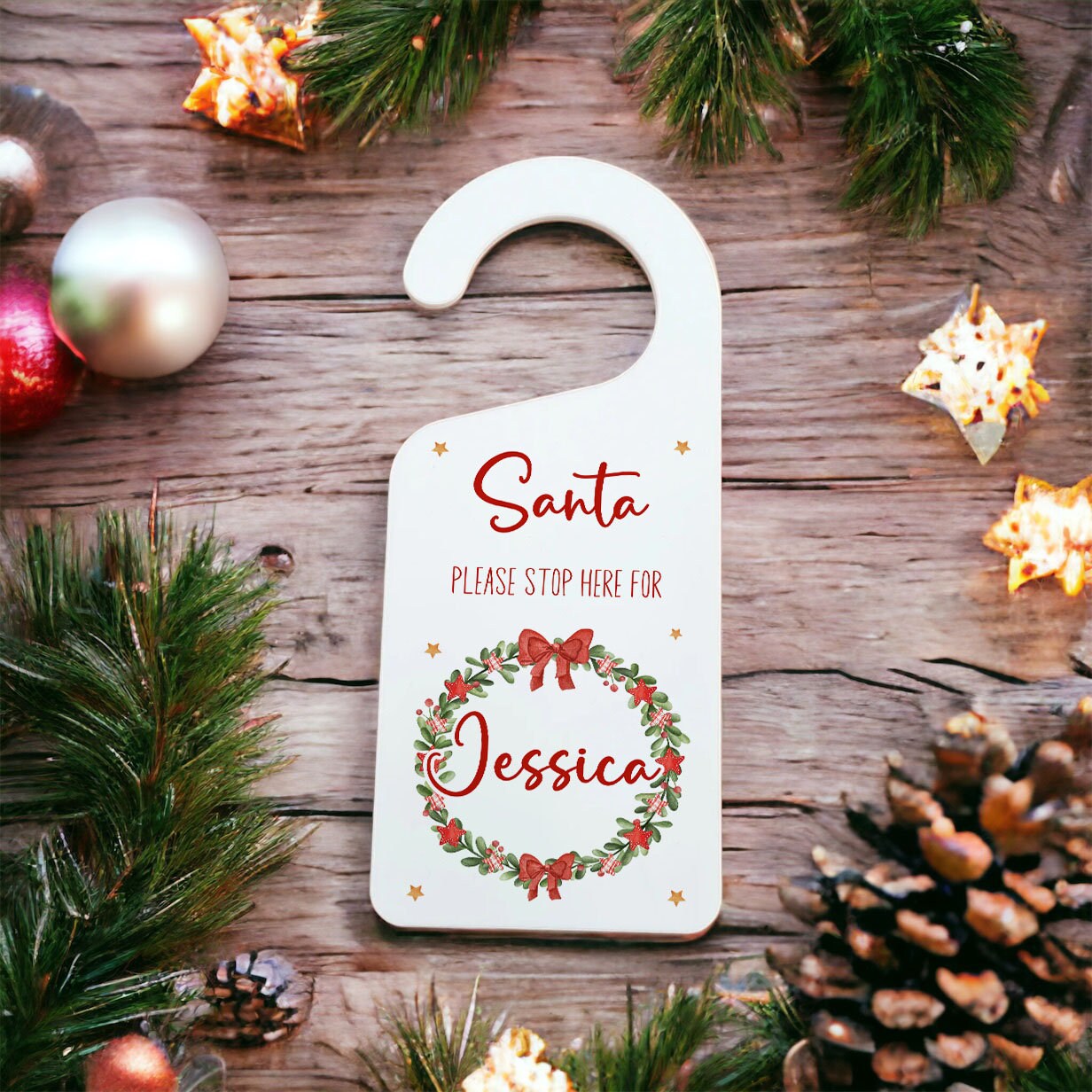 Personalised acrylic Santa Stop Here door hanger with festive wreath design and custom name