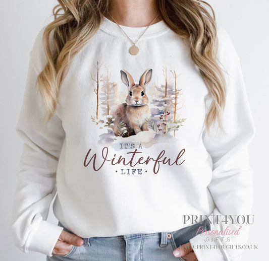 Ladies white sweatshirt with a woodland bunny rabbit design and It's a Winterful Life slogan