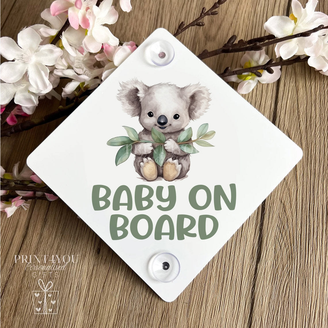 Baby on board aluminium car window sign with koala bear design and window suction cups attached