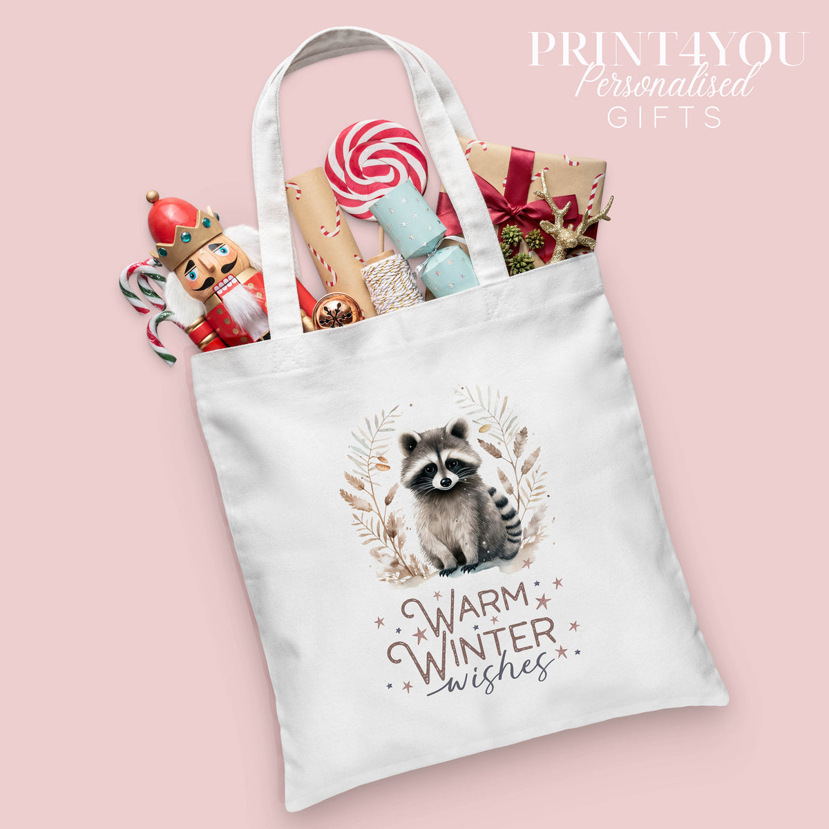Cotton canvas-style tote bag with a wintry Christmas print, personalised with a name