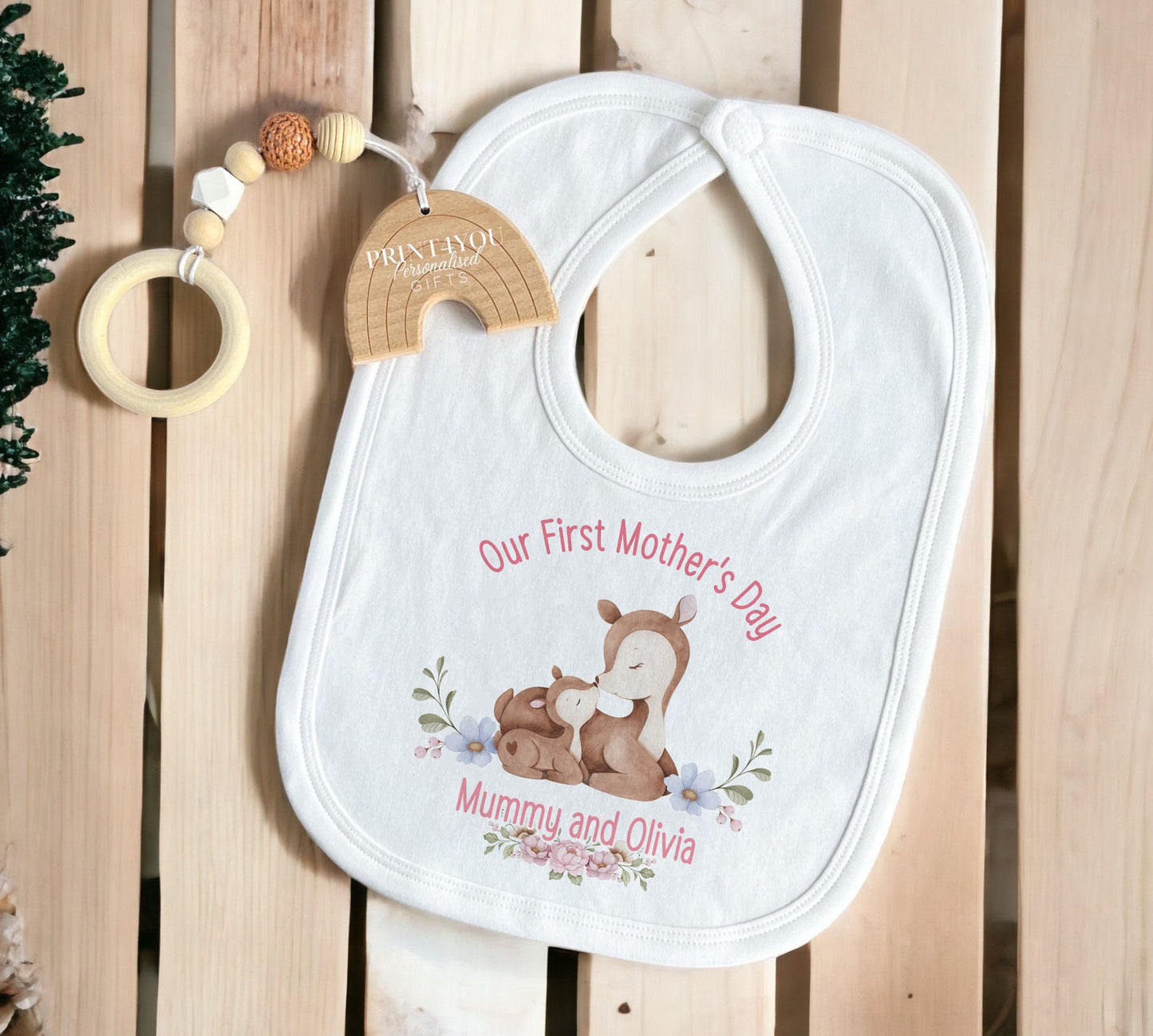 Personalised first Mother's Day baby vest and bib set styled together.