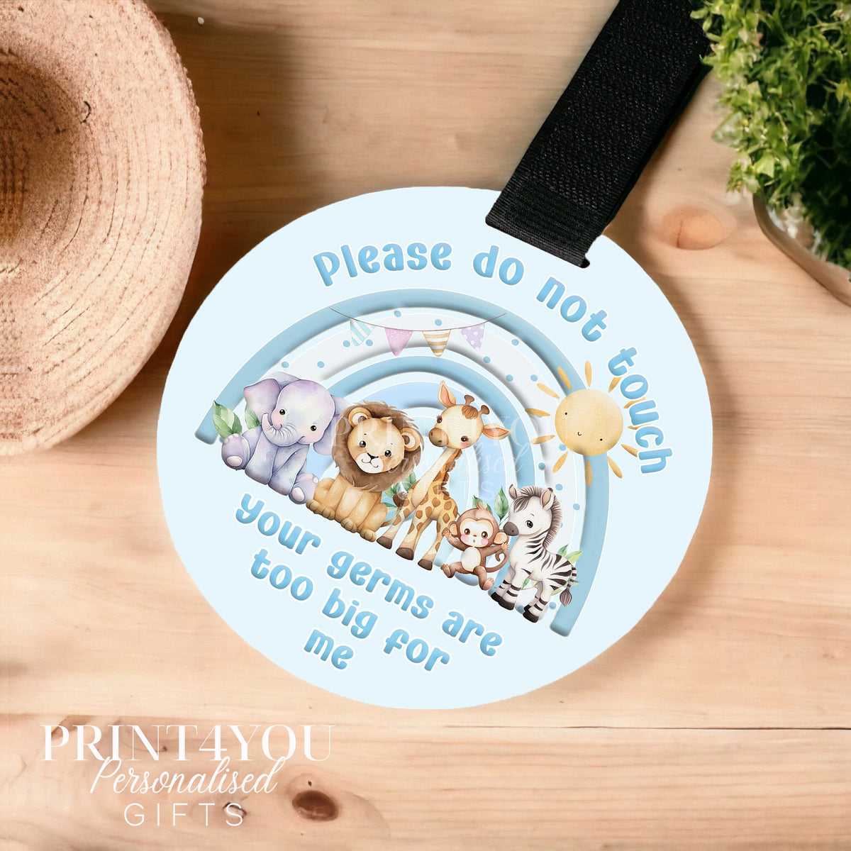 Blue safari rainbow pram tag sign reading please do not touch, fitted with a black Velcro strap