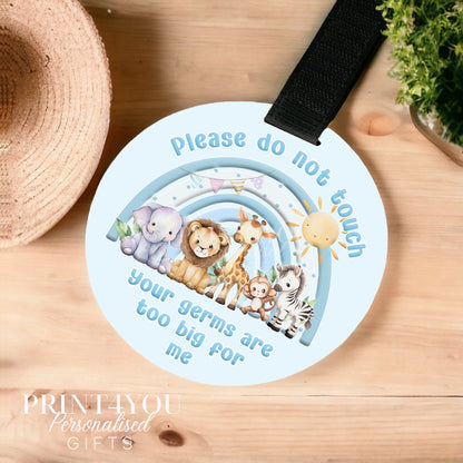 Blue safari rainbow pram tag sign reading please do not touch, fitted with a black Velcro strap
