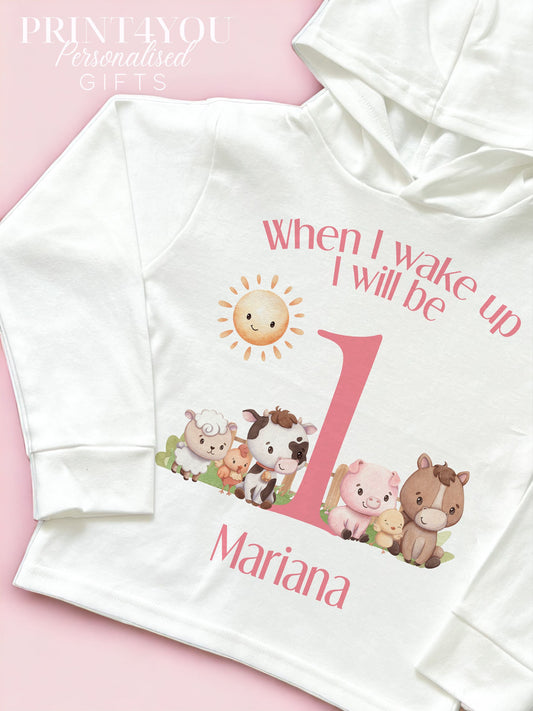 Bib printed with the pink farm animals first birthday design.