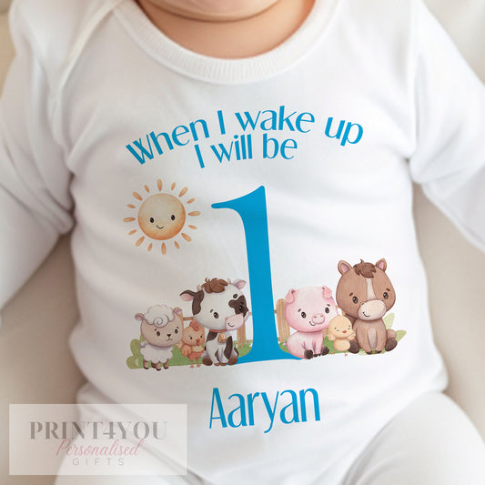 Personalised blue farm animals first birthday bib, printed on soft cotton with space for your baby's name.