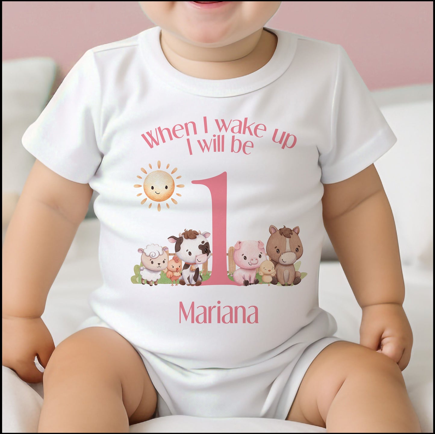 Personalised pink farm animals bib with baby's name printed on soft white cotton.
