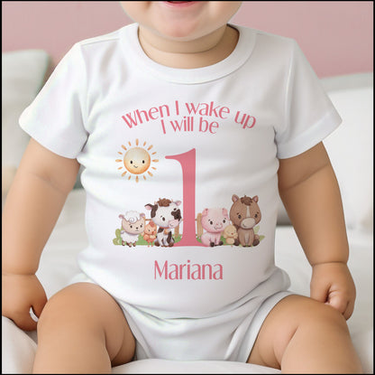 Personalised pink farm animals bib with baby's name printed on soft white cotton.