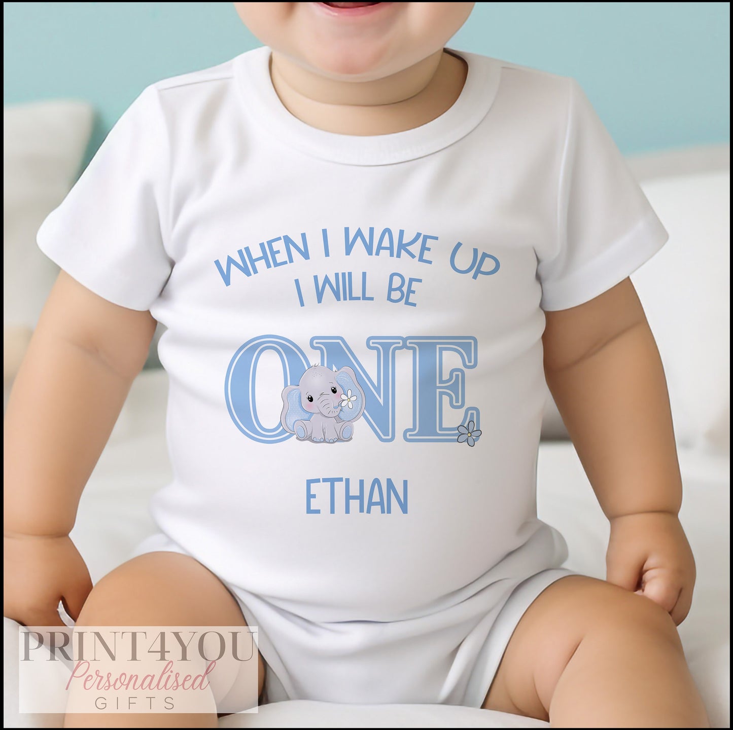 Personalised blue elephant sleepsuit with 'When I Wake Up I Will Be One' text and baby name.
