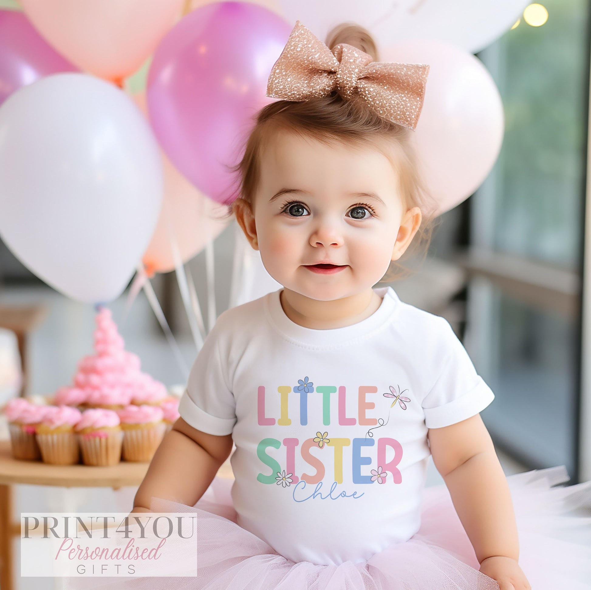 Close-up of the Little Sister design personalised with a baby's name on soft cotton